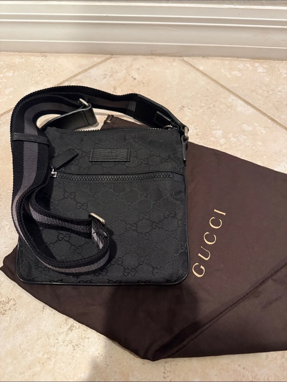 Authentic Gucci Black GG Monogram Messenger Bag with Striped Strap